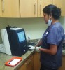 Fig 1. Dental assistant using the extraoral scanner.