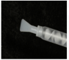 Fig. 4 A ribbon-tip spatula can make it easier to apply the light-body wash material, which should ideally be 1-mm to 2-mm thick.
