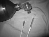 Figure 10. Attaching a bag-valve device to needle hub. The adapter from a size 3 endotracheal tube will insert directly into the hub of the catheter or one from a size 7.0 endotracheal tube will tightly insert into the barrel of a 3-mL syringe. The bag-valve device is connected to a 100% oxygen source at 10 L/min to 15 L/min and squeezed 10 to 15 times per minute to provide oxygen through the cannula.