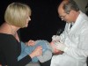 Figure 1  With the knee-to-knee examination, the child is placed facing up on the lap of the caregiver and the dentist.