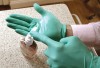 Figure 4  Because standard operatory gloves are not sterile and handling them by hand may introduce some bacteria from the skin to these surfaces, washing gloves with an alcohol solution after putting them on is a good way of reducing the potential for germs from the operator᾿s skin to be transferred to the patient.